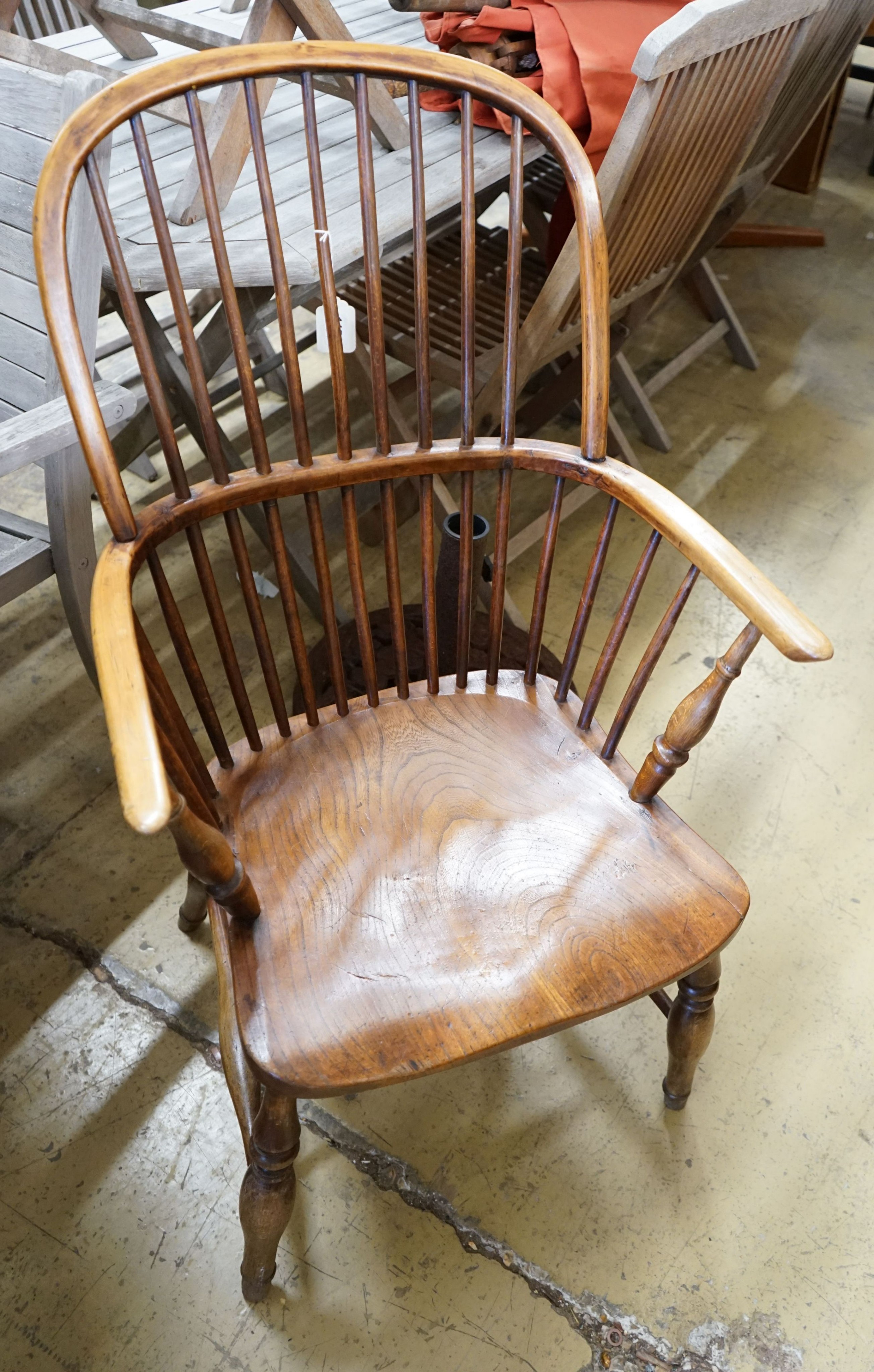 A mid 19th century ash and beech Windsor comb back armchair, width 56cm depth 43cm height 102cm